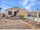 Charming single story home with desert landscaping and a two-car garage at 6847 W Palo Brea Ln, Peoria, AZ 85383