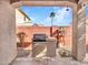 Covered patio featuring built-in barbecue, tiled countertop, and mature landscaping adding privacy and charm at 6847 W Palo Brea Ln, Peoria, AZ 85383