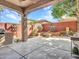 Back patio with a built in fire pit, grilling station, and outdoor lounge at 6847 W Palo Brea Ln, Peoria, AZ 85383