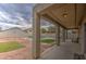 Covered patio with a view of a pool and gravel landscape in the backyard at 7013 W Branham Ln, Laveen, AZ 85339