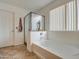 A modern bathroom featuring a bathtub and separate glass enclosed shower at 7013 W Branham Ln, Laveen, AZ 85339