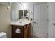 Well-lit bathroom with vanity and a convenient toilet paper holder at 7013 W Branham Ln, Laveen, AZ 85339