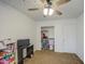 Bright bedroom with a ceiling fan and stars painted on the ceiling above at 7013 W Branham Ln, Laveen, AZ 85339