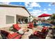 Outdoor living space featuring a pool, fire pit, and lounge seating at 7161 W Saddlehorn Rd, Peoria, AZ 85383