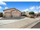 Charming single-Gathering home featuring a three-car garage, desert landscaping, and a neatly manicured lawn at 7161 W Saddlehorn Rd, Peoria, AZ 85383