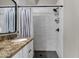 Modern bathroom featuring shower with white subway tile and a black shower head at 850 E Vaughn Ave, Gilbert, AZ 85234