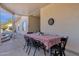 Spacious covered patio with dining table, ideal for outdoor gatherings and entertaining guests at 850 E Vaughn Ave, Gilbert, AZ 85234