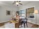 Bright dining area with a rustic wood table set by large, sunlit windows at 850 E Vaughn Ave, Gilbert, AZ 85234