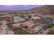 Aerial view of desert home showcasing a pool, spa, outdoor patio, and well-maintained landscaping at 8612 S 30 Th Way, Phoenix, AZ 85042