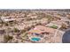 Expansive desert property highlighting pool, lush artificial turf, and elevated outdoor seating areas at 8612 S 30 Th Way, Phoenix, AZ 85042