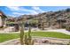 Backyard featuring outdoor dining, desert landscaping, and desert hillside backdrop at 8612 S 30 Th Way, Phoenix, AZ 85042