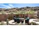 Patio seating area in backyard with desert landscaping and mountain views at 8612 S 30 Th Way, Phoenix, AZ 85042