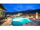 Backyard pool with a built-in spa and waterfall, surrounded by desert landscaping and mountain views at 8612 S 30 Th Way, Phoenix, AZ 85042