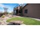 Desert home backyard with an upper deck, patio and artifical turf lawn at 8612 S 30 Th Way, Phoenix, AZ 85042