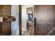 Rustic style bathroom with decorative wood door and trim, with stone floor tiles at 8612 S 30 Th Way, Phoenix, AZ 85042