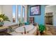 Inviting soaking tub with tile surround situated beneath a bright window at 8612 S 30 Th Way, Phoenix, AZ 85042