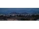 Distant view of city and landmark mountain peaks in the distance at dusk at 8612 S 30 Th Way, Phoenix, AZ 85042