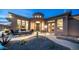 Inviting front entrance with desert landscaping and cozy outdoor seating around a firepit under the tower at 8612 S 30 Th Way, Phoenix, AZ 85042