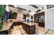 Elegant kitchen showcasing a center island, stainless steel appliances, and rich wood cabinetry at 8612 S 30 Th Way, Phoenix, AZ 85042