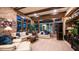 Cozy living room features exposed brick accent wall, beautiful beam ceilings, and a picture window at 8612 S 30 Th Way, Phoenix, AZ 85042