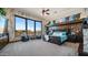 Tranquil main bedroom boasting floor-to-ceiling windows with scenic views, sitting area and elegant finishes at 8612 S 30 Th Way, Phoenix, AZ 85042