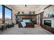 Luxurious bedroom with stone accent walls, wooden accents, fireplace and a large window at 8612 S 30 Th Way, Phoenix, AZ 85042