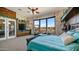 Spacious main bedroom with a large window view, a ceiling fan, and decorative wall art at 8612 S 30 Th Way, Phoenix, AZ 85042