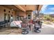 Covered patio with comfortable seating, a grill, and a spiral staircase at 8612 S 30 Th Way, Phoenix, AZ 85042