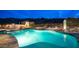 Stunning backyard pool featuring a spa, waterfall, and desert landscape with views of the mountains at 8612 S 30 Th Way, Phoenix, AZ 85042