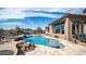 Resort-style backyard with pool, spa, rock accents, and desert landscaping at 8612 S 30 Th Way, Phoenix, AZ 85042