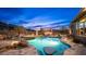 Inviting backyard pool and spa with a sitting area and a waterfall feature, perfect for outdoor entertaining at 8612 S 30 Th Way, Phoenix, AZ 85042