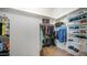 Well-organized walk-in closet with ample hanging space and shelving for clothes and shoes at 8612 S 30 Th Way, Phoenix, AZ 85042