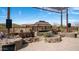 Backyard rock water feature, desert landscaping, and steel pergola in background at 8612 S 30 Th Way, Phoenix, AZ 85042