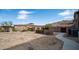 Desert home exterior with a large, undeveloped yard and mountain views at 8612 S 30 Th Way, Phoenix, AZ 85042