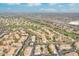 Overhead view of the community showcasing lush landscaping, green golf course, and serene surroundings at 9633 S 51St St, Phoenix, AZ 85044