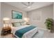 Bright bedroom with white plantation shutters and a ceiling fan at 9633 S 51St St, Phoenix, AZ 85044