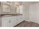 Bright main bathroom featuring a double sink vanity and built-in storage cabinet at 9633 S 51St St, Phoenix, AZ 85044