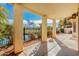 Covered patio area with views of a pond and lush landscaping at 9633 S 51St St, Phoenix, AZ 85044