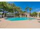 Community pool with a charming cabana, lounge chairs, and clear blue water at 9633 S 51St St, Phoenix, AZ 85044