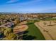 Scenic aerial shot capturing the pristine golf course, showcasing lush greenery, sand traps, and a verdant landscape at 9638 E Tranquility Way, Sun Lakes, AZ 85248