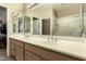 Bright bathroom with double sinks, modern fixtures, and a glass-enclosed shower at 9638 E Tranquility Way, Sun Lakes, AZ 85248