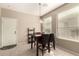 Cozy dining area with a dark wood table set near a bright window at 9638 E Tranquility Way, Sun Lakes, AZ 85248