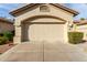 Spacious two-car garage with a concrete driveway and well-maintained landscaping at 9638 E Tranquility Way, Sun Lakes, AZ 85248