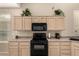 Well-lit kitchen featuring stainless steel appliances and lots of cabinet storage space at 9638 E Tranquility Way, Sun Lakes, AZ 85248