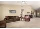 Comfortable living room with neutral carpet, ceiling fan, and piano at 9638 E Tranquility Way, Sun Lakes, AZ 85248