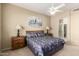 Well-lit main bedroom featuring a ceiling fan, nightstands, and a comfortable bed at 9638 E Tranquility Way, Sun Lakes, AZ 85248