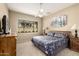 Comfortable main bedroom with a ceiling fan, a large window, and neutral decor at 9638 E Tranquility Way, Sun Lakes, AZ 85248