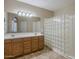 Bathroom featuring dual sinks and walk-in shower at 1170 S Agnes Ln, Gilbert, AZ 85296