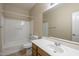 Bathroom features a vanity with sink, toilet and shower/tub combo at 1170 S Agnes Ln, Gilbert, AZ 85296