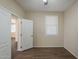 Bedroom with a ceiling fan and window at 1170 S Agnes Ln, Gilbert, AZ 85296